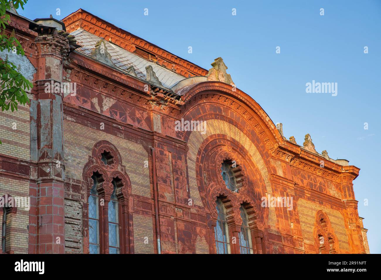 Former synagogue, now the Philharmonic Orchestra House, on the bank of the river Uzh. Uzhhorod, Ukraine. Stock Photo