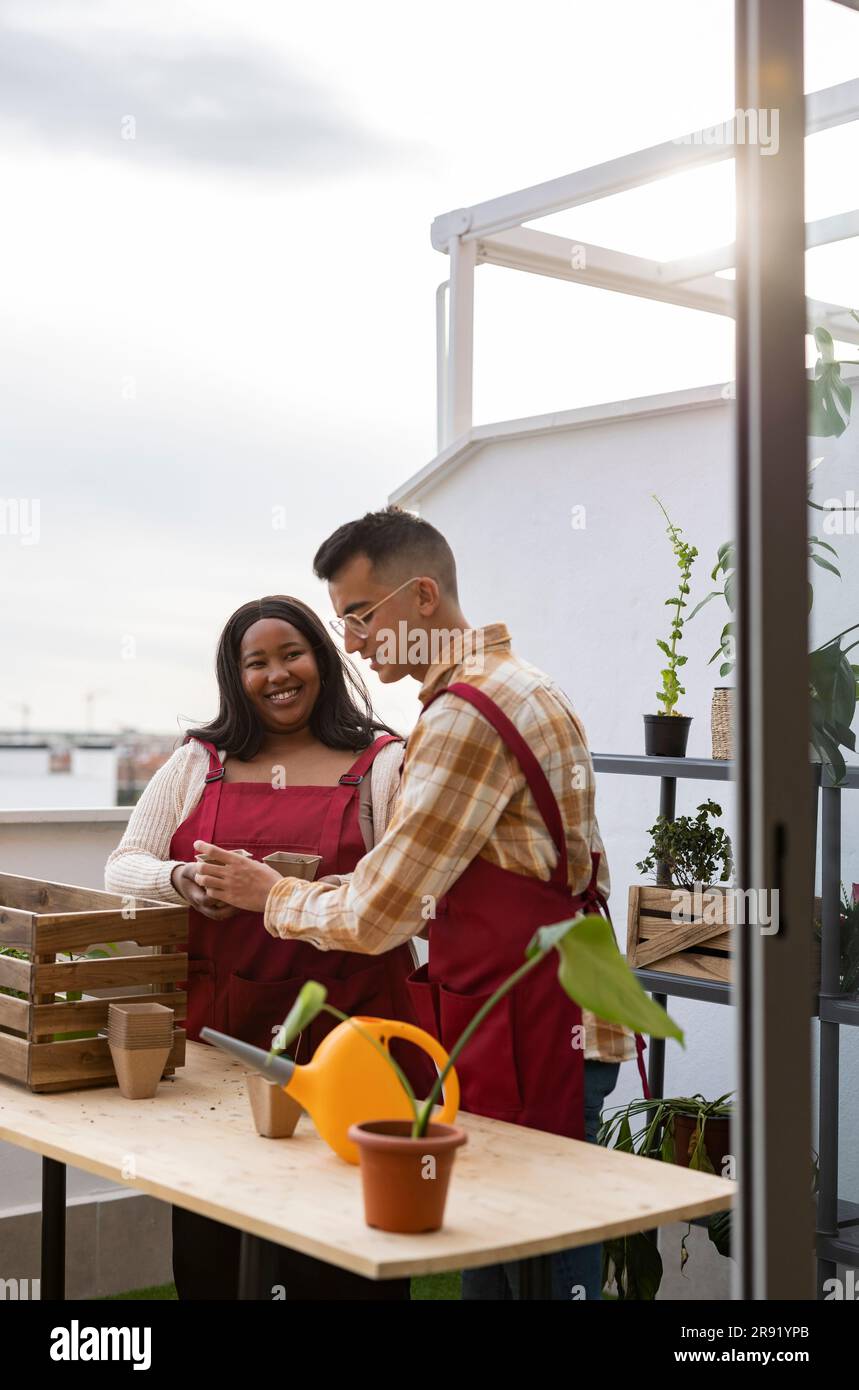 Gardening couple balcony hi-res stock photography and images - Alamy