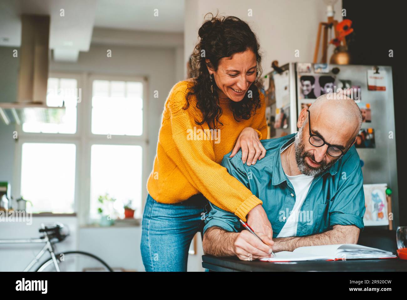 Man and woman discussing over financial bills at home Stock Photo