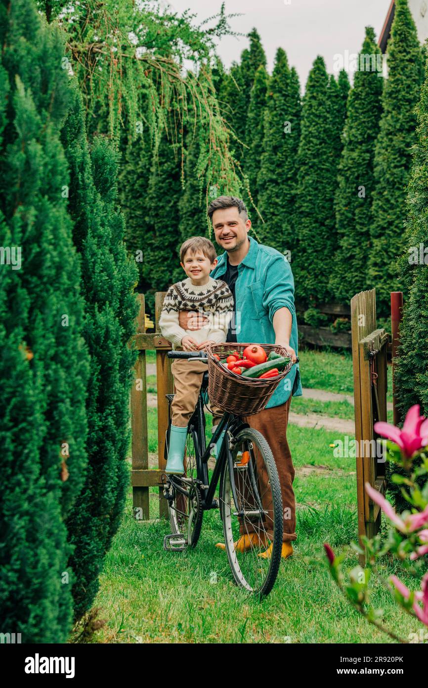 Father and son sitting on grass hi-res stock photography and images - Alamy