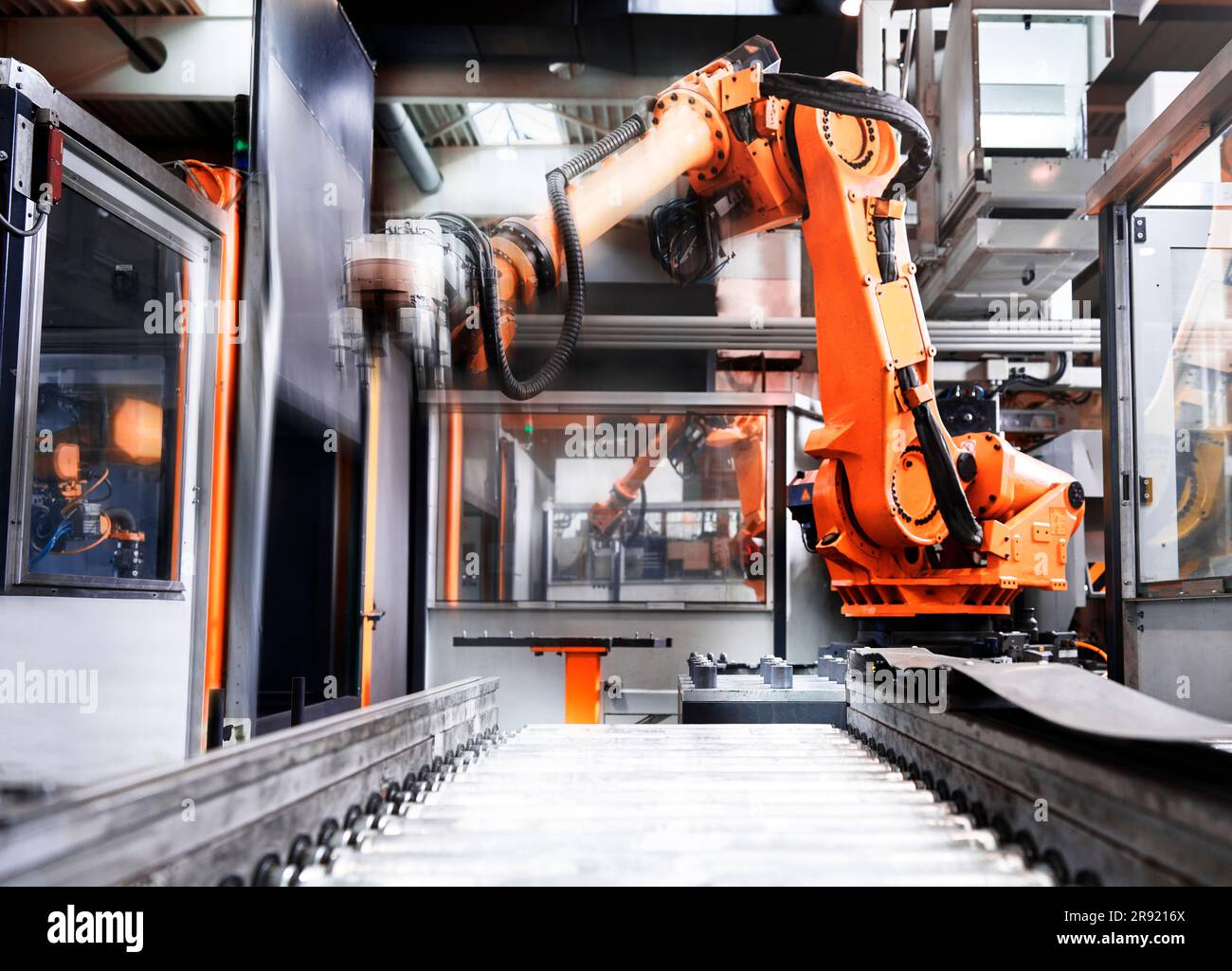 Robotic arm over production line in factory Stock Photo