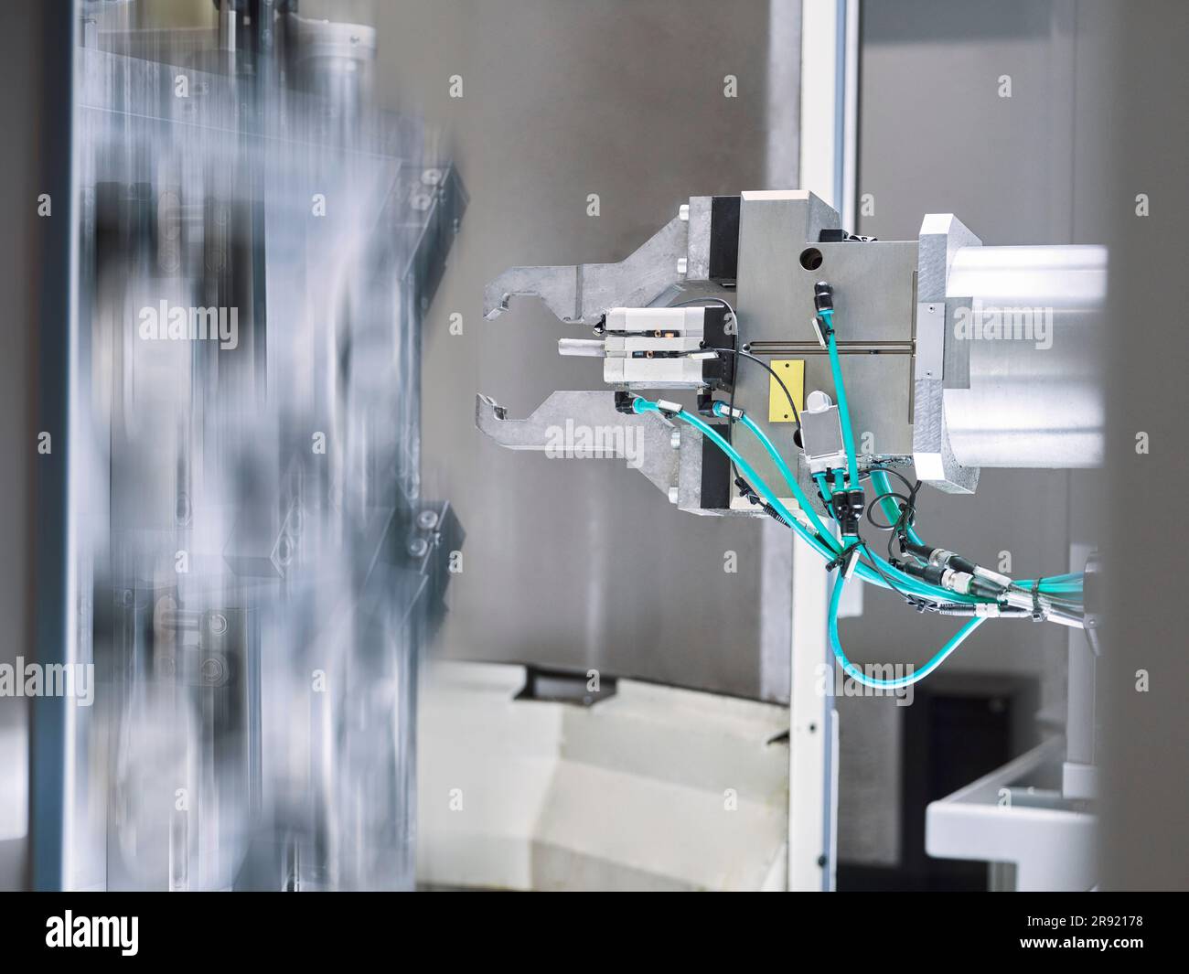 Robotic machine part at production line in factory Stock Photo
