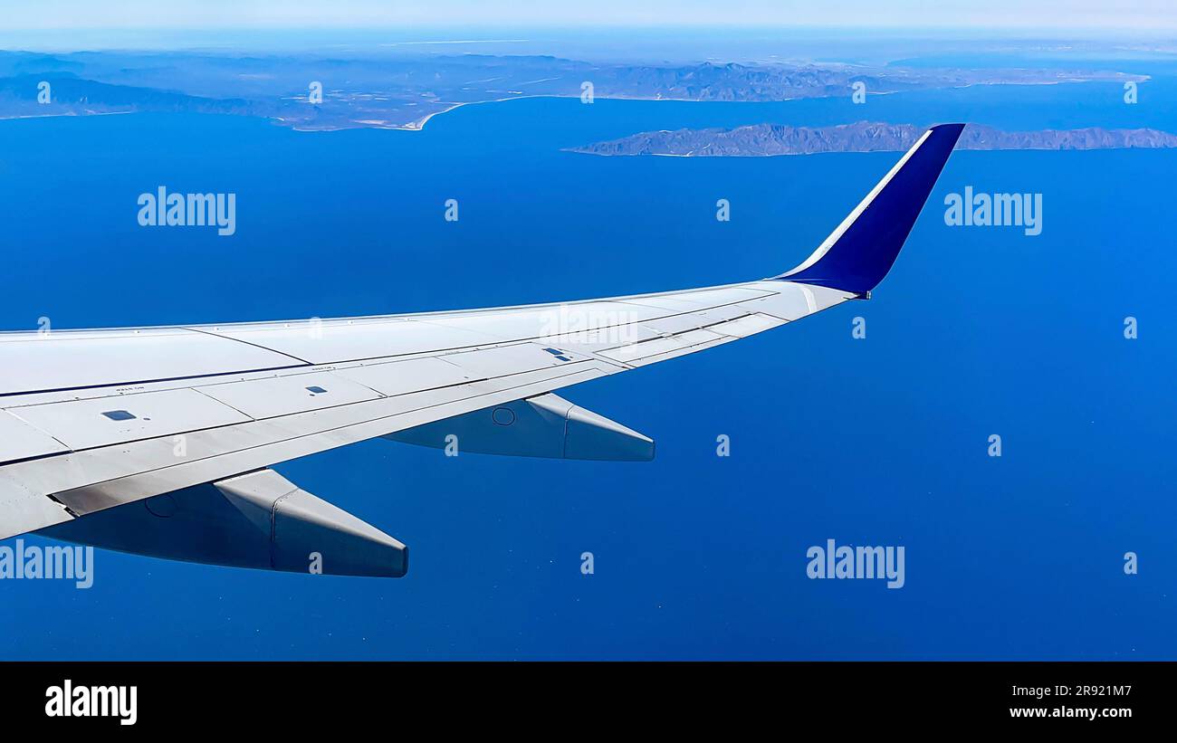 Aircraft flying over the Pacific Ocean and approaching an airport in