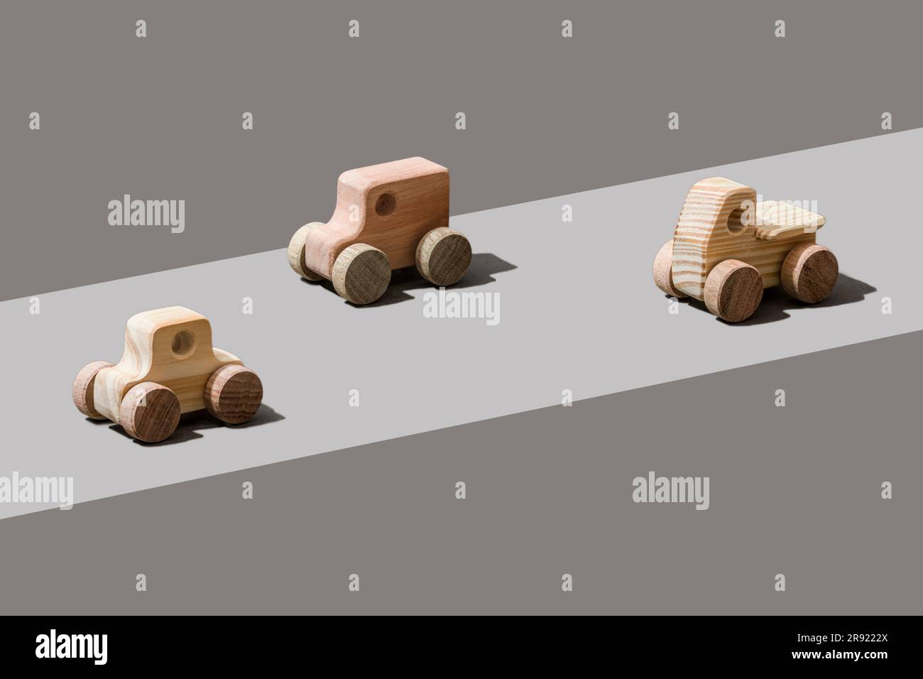 Wooden cars on gray background Stock Photo