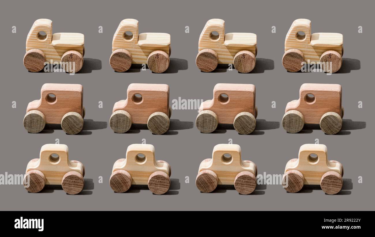 Wooden toy cars on gray background Stock Photo