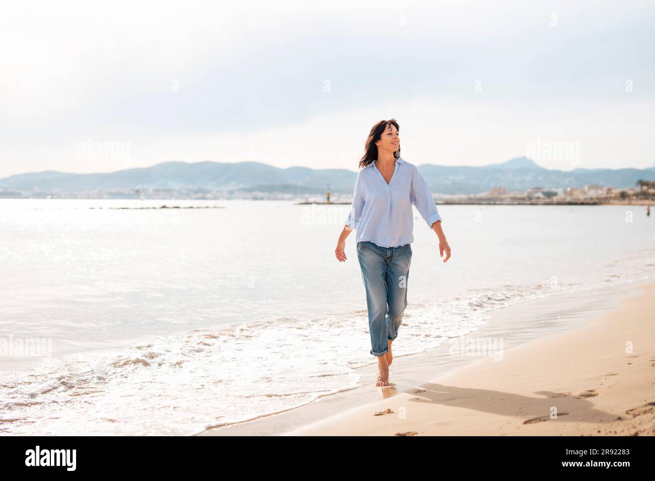 Mature woman beach holiday hi-res stock photography and images - Alamy