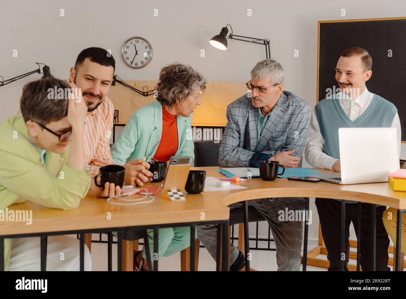 Group of business people talking in the studio, recording video lesson Stock Photo