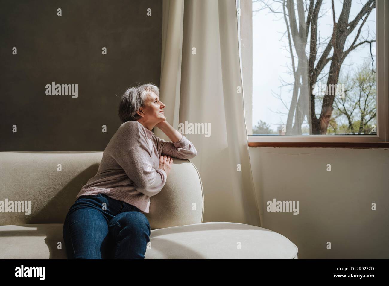 Mature woman relaxing couch hi-res stock photography and images - Alamy