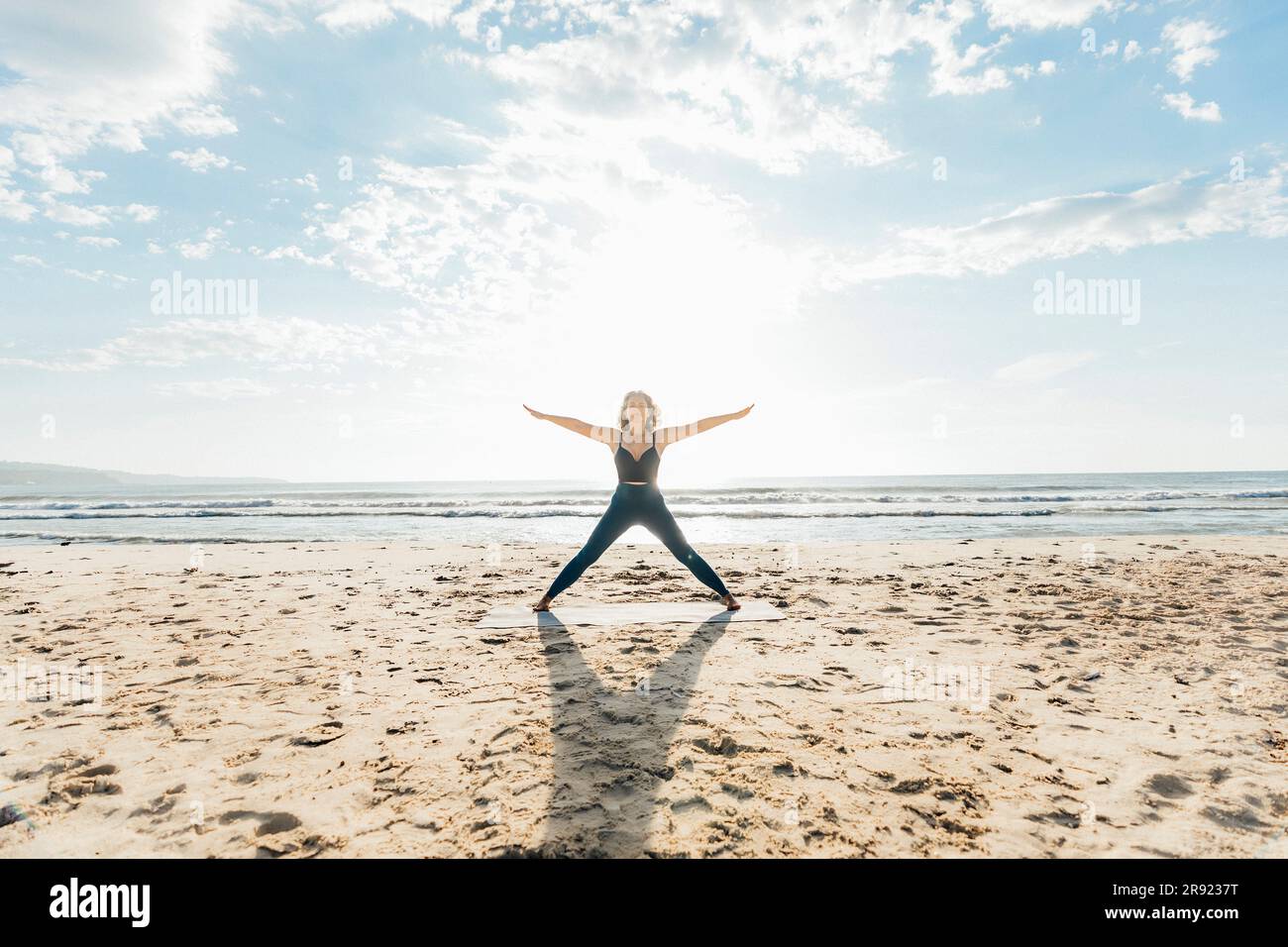 Woman outstretched arms yoga hi-res stock photography and images - Alamy