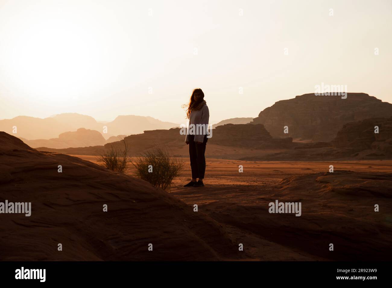 Woman standing on desert hi-res stock photography and images - Alamy