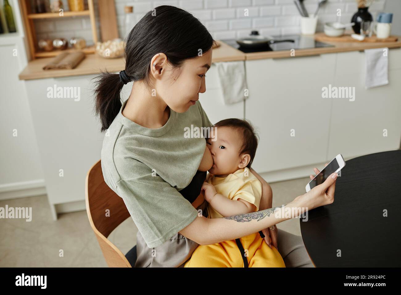 Breastfeeding baby asian hi res stock photography and images Alamy