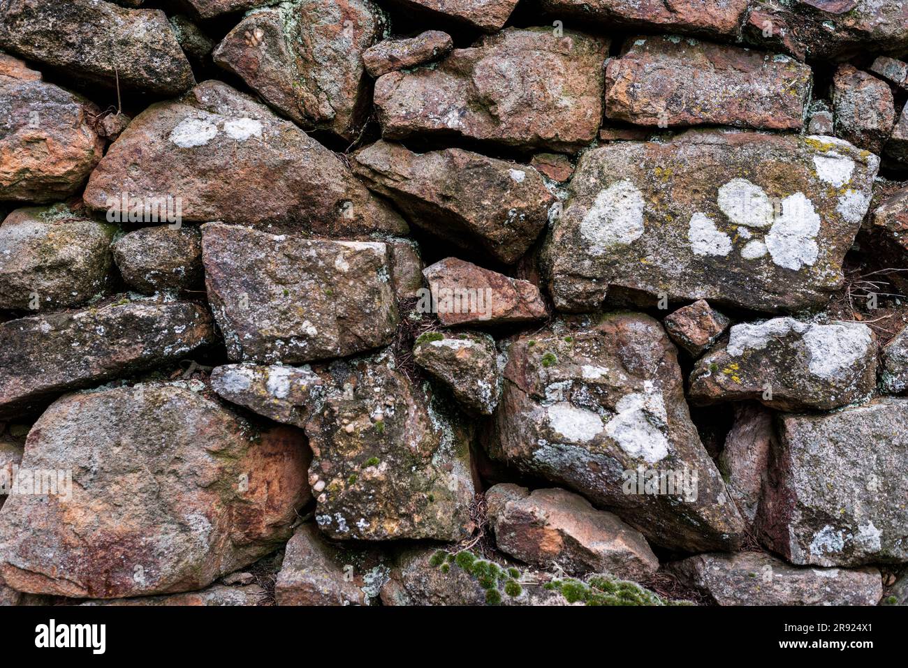 Background, pattern. Full frame shot of wet stone wall. Stock Photo