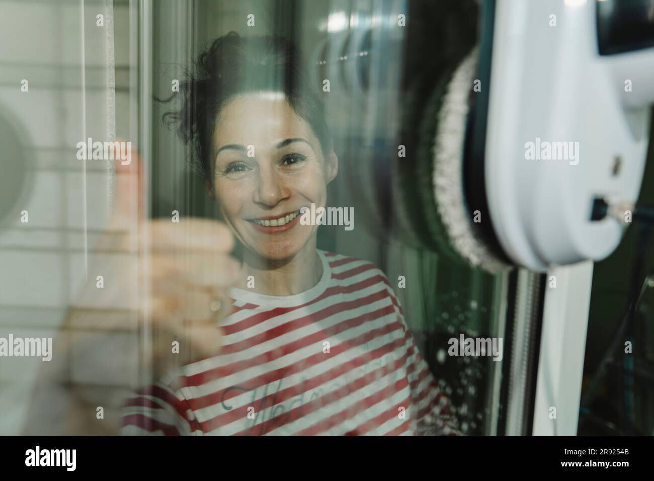 Happy woman showing thumbs up gesture Stock Photo - Alamy