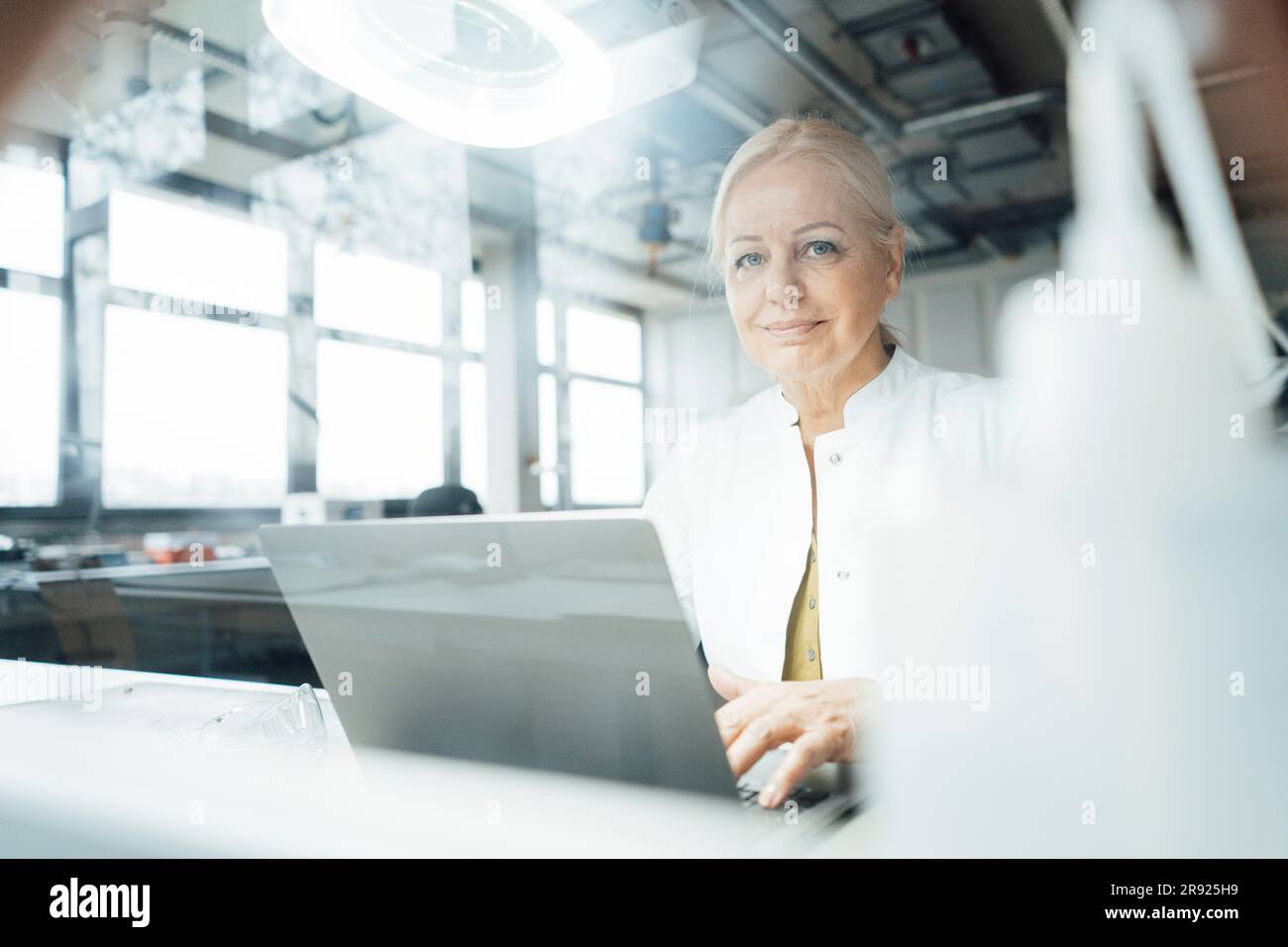 Woman scientist research laptop hi-res stock photography and images - Alamy