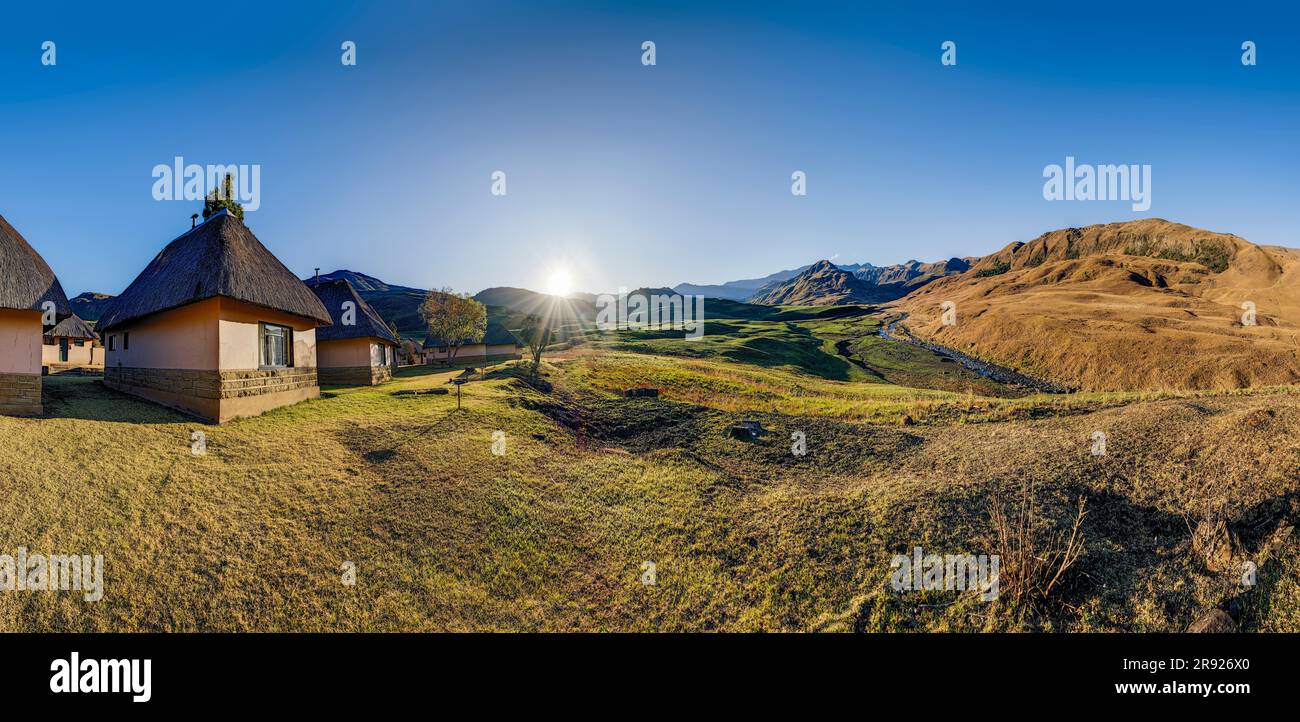 Huts in front of mountains at KwaZulu-Natal, Drakensberg, South Africa Stock Photo