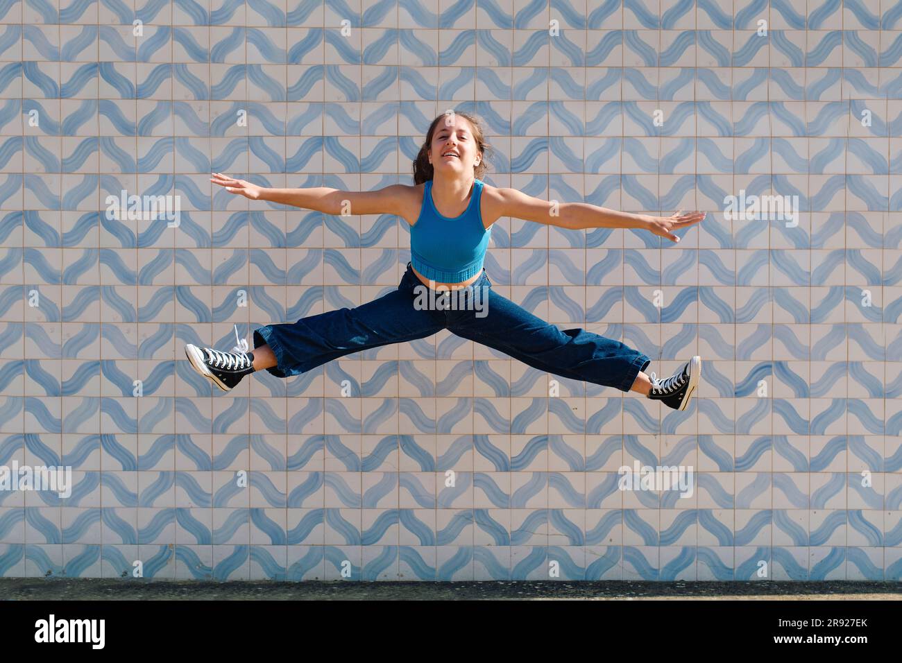 Girl jumping in mid air hi-res stock photography and images - Alamy
