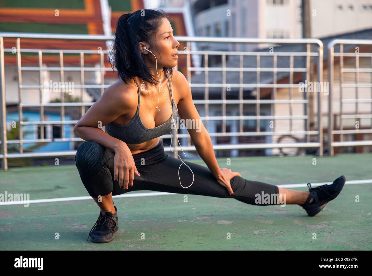 Asian female stretching legs on hi-res stock photography and images - Alamy