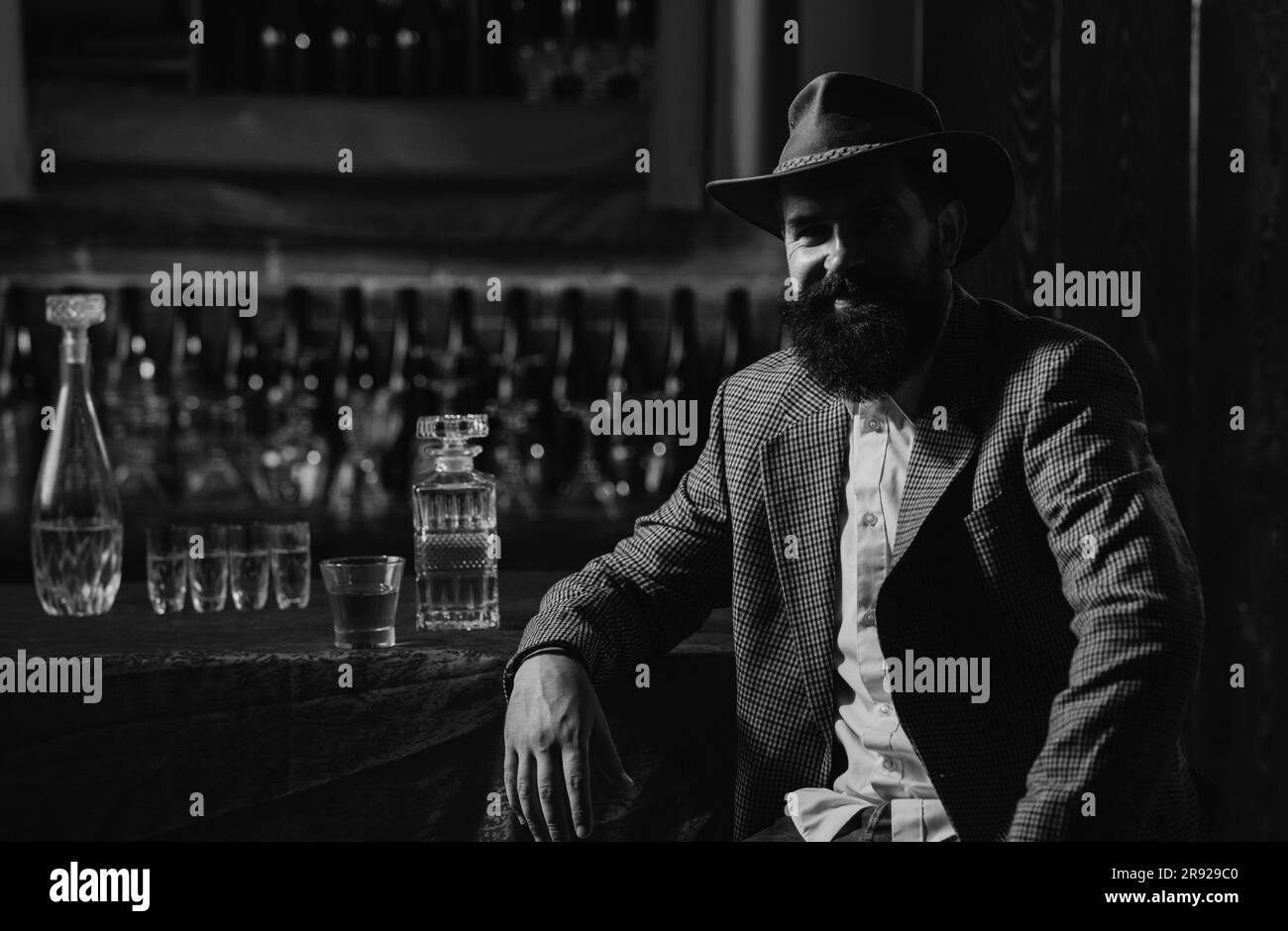 Bearded barmen, barkeeper or bartender in bar. Man with beard and mustache, vintage retro Stock Photo