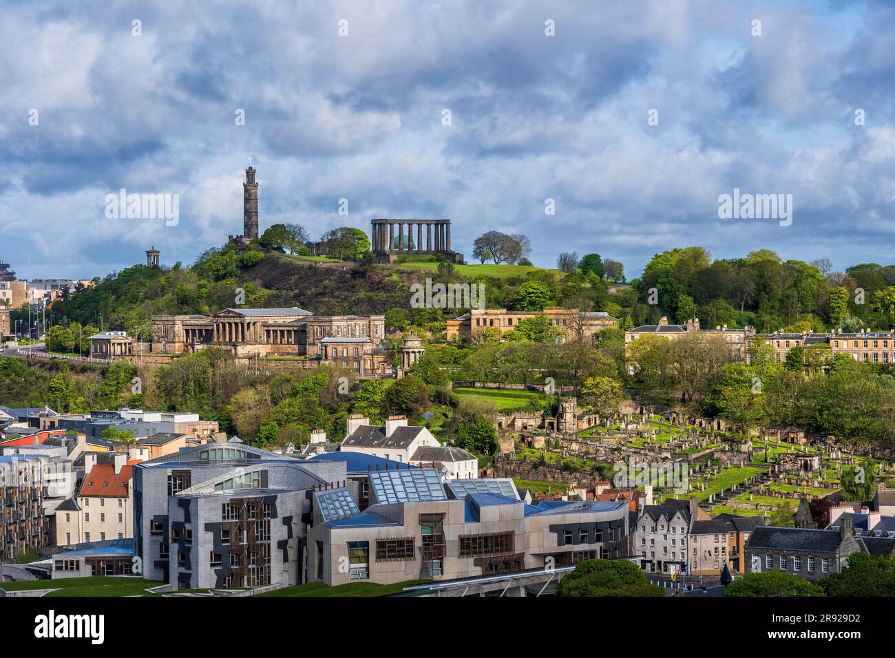 UK, Scotland, Edinburgh, Clouds over Calton Hill, Old Royal High School, New Calton Burial Ground and Scottish Parliamentary Building Stock Photo