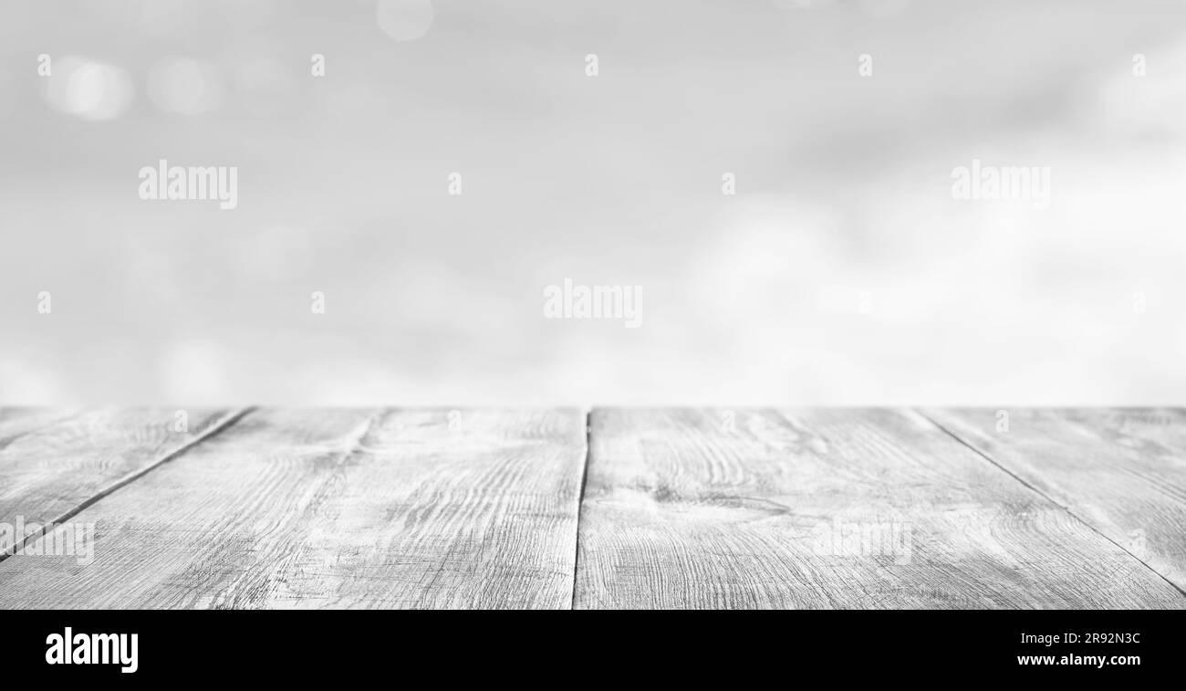 Empty white wooden surface against blurred background, bokeh effect. Banner with space for design Stock Photo