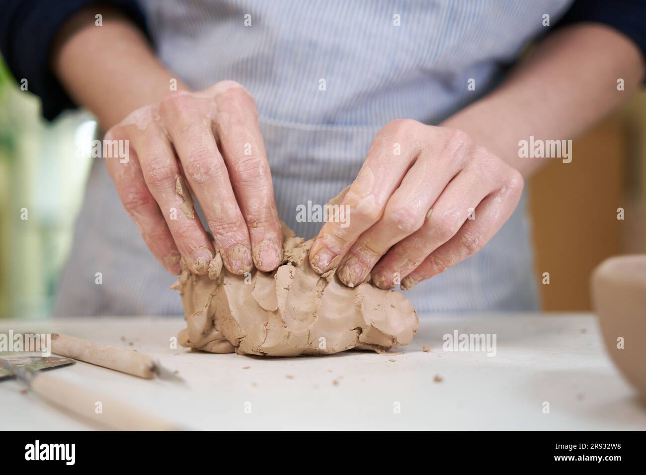 Closeup hands of ceramic artist wedging clay in art studio Stock Photo Alamy