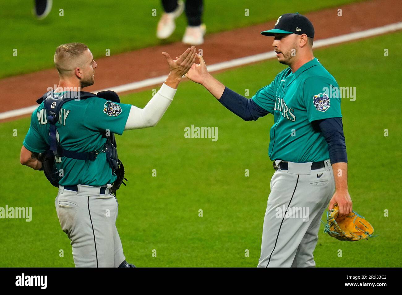 Seattle Mariners catcher Tom Murphy, left, and relief pitcher Tayler