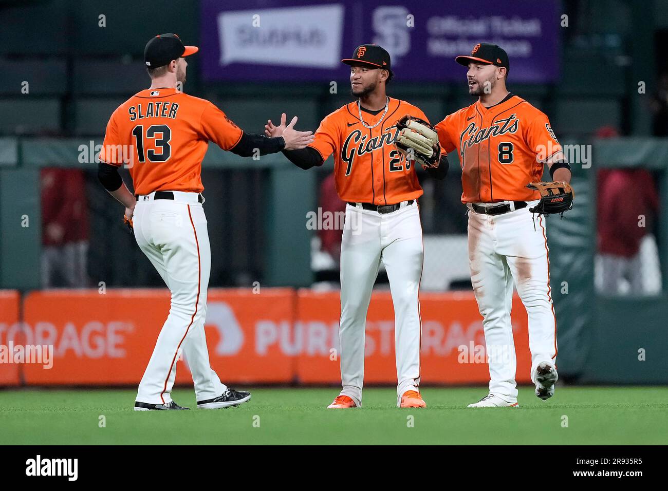 San Francisco Giants' Austin Slater (13), Luis Matos (29), and Michael  Conforto (8) celebrate the team's