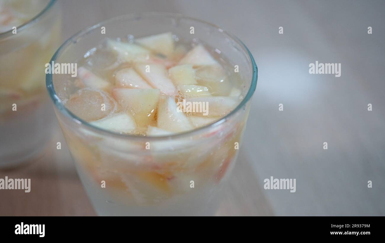 Soda with peach on the wooden table. Stock Photo