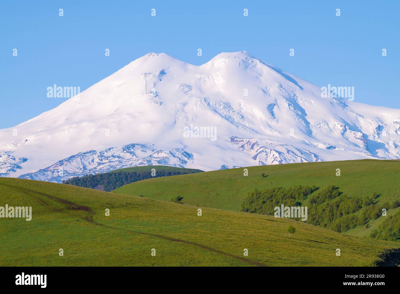 View of Elbrus on a sunny June morning. Kabardino-Balkaria, Russian Federation Stock Photo