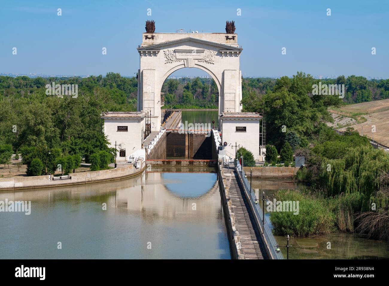 VOLGOGRAD, RUSSIA - JUNE 15, 2023: Arch of the first gateway of the Volga-Don Canal on a sunny June day Stock Photo