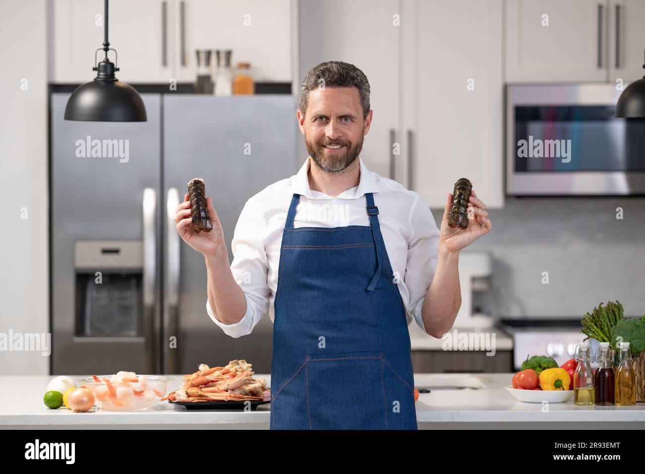 happy man cook lobster seafood. man cook lobster seafood. man cook ...