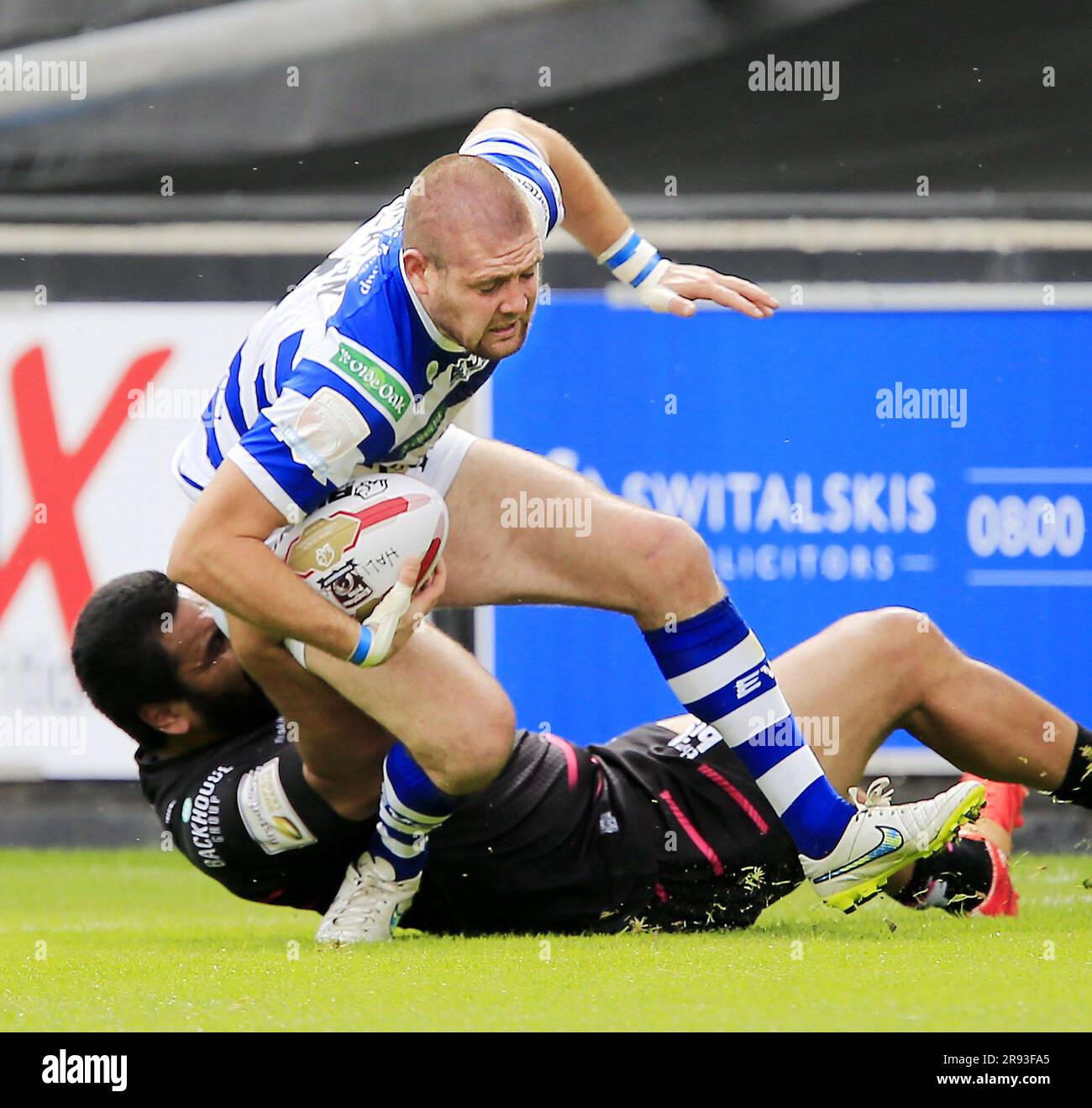 UK. 13th Aug, 2015. PICTURE BY CHRIS MANGNALL /SWPIX.COM. Rugby League - Super 8's - Halifax RLFC v Widnes Vikings - The Shay, Halifax, England - 09/08/15 Halifax's Ben Heaton tackled by Widnes's Lloyd White Credit: SWpix/Alamy Live News Stock Photo