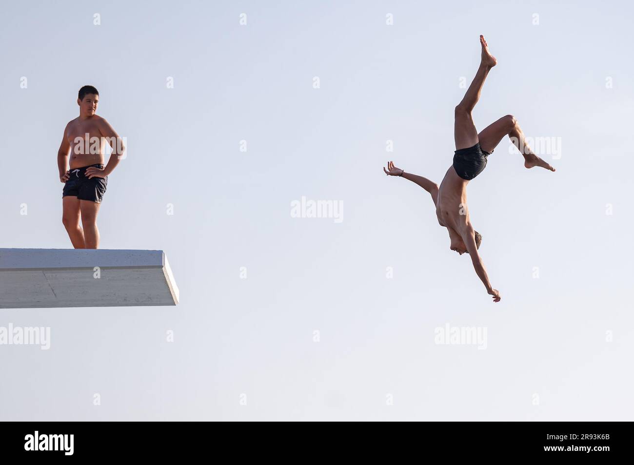 Zadar, Croatia. 23rd June, 2023. A boy jumps into sea from a top of 10