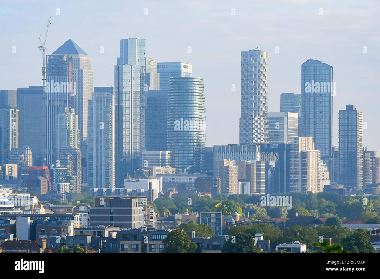 Point Hill, Lewisham, London, UK.  24th June 2023.  UK Weather.  View from Point Hill at Lewisham in London looking towards the skyscrapers of Canary Wharf on a morning of scorching hot hazy sunshine.  Picture Credit: Graham Hunt/Alamy Live News Stock Photo