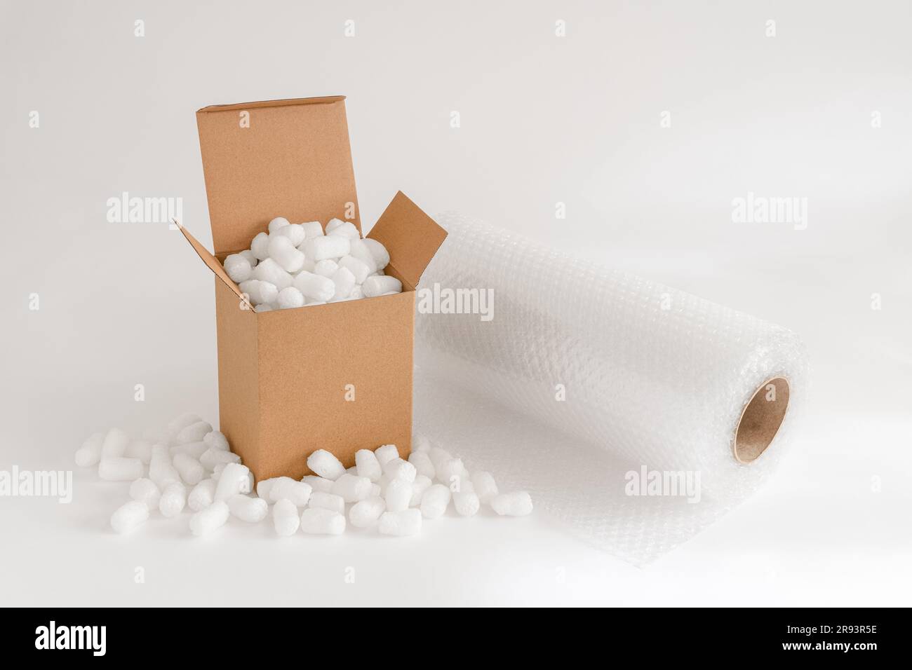 Cardboard box isolated on the white background filled with packing