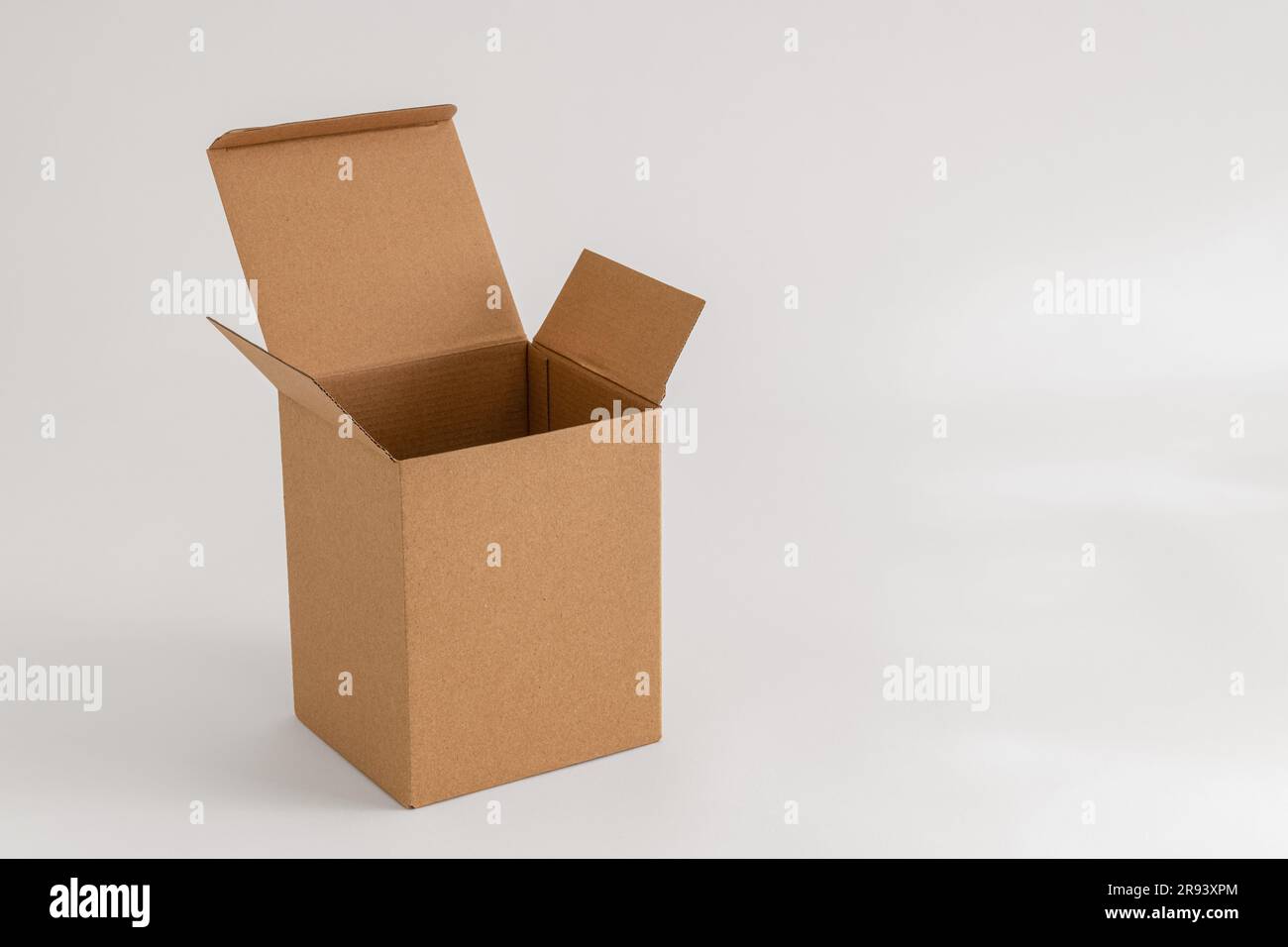 Empty cardboard box isolated on the white background Stock Photo - Alamy