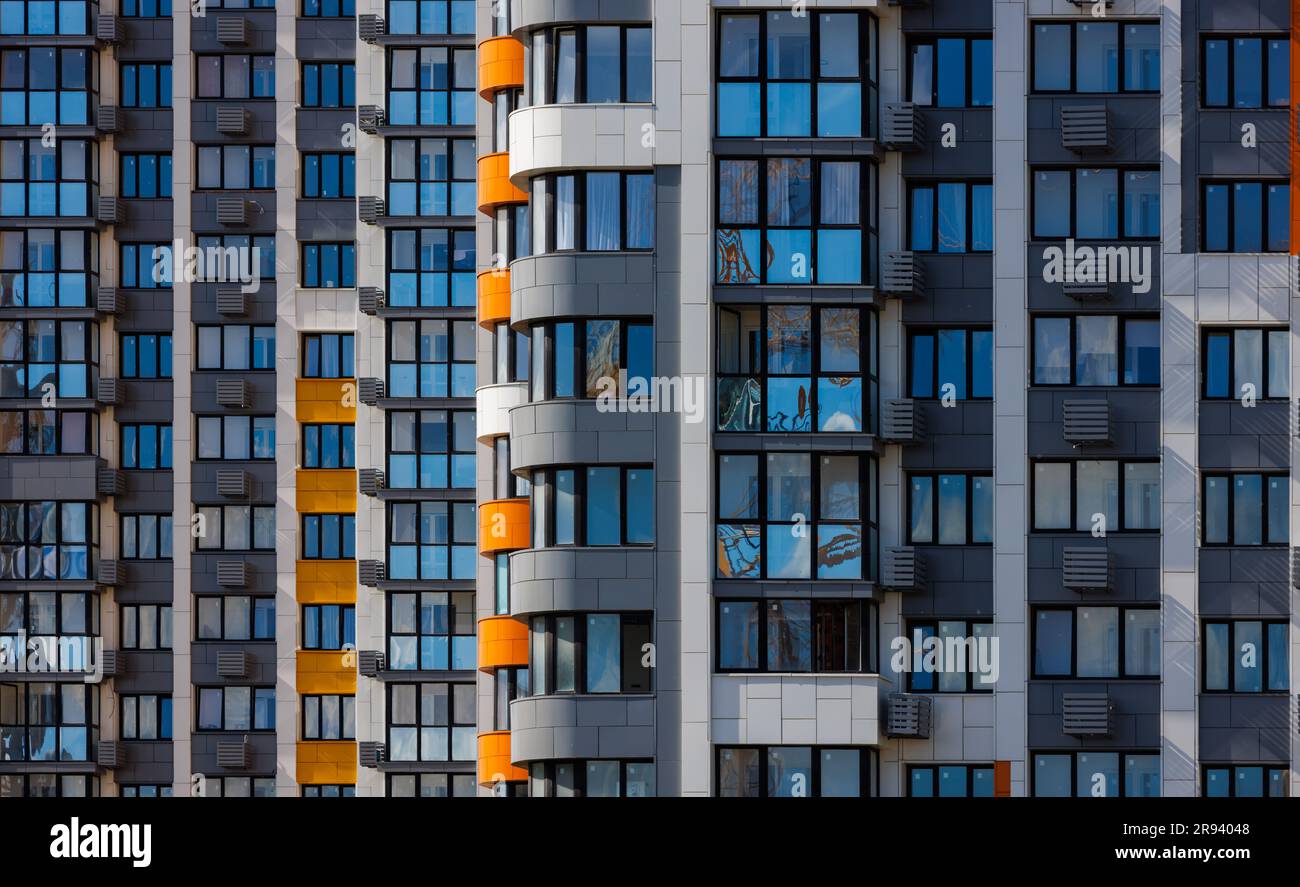 full-frame view of freshly built high rise apartment building in white ...