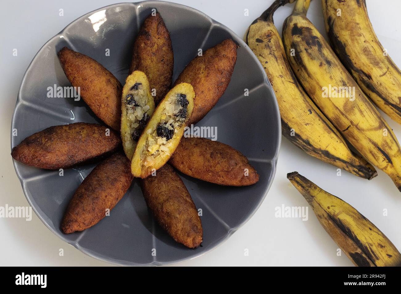 Unnakai. Stuffed plantain fritters from malabar, Kerala. Steamed and mashed plantain stuffed with a filling made of sweetened coconut, ghee roasted ca Stock Photo