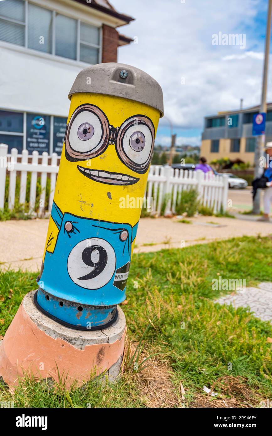 An Australian-made Telstra phone pillar or copper cable cabinet, in North Bondi, Sydney, Australia has been painted to resemble Kevin the Minion Stock Photo