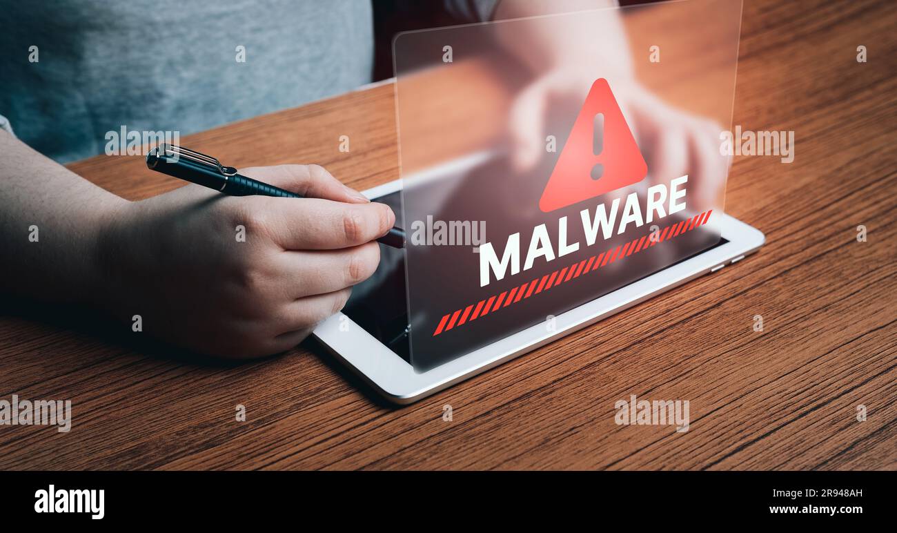 Woman use digital tablet to protect devices from malware alert. Compromised information concept. Internet virus cyber security and cybercrime. Stock Photo