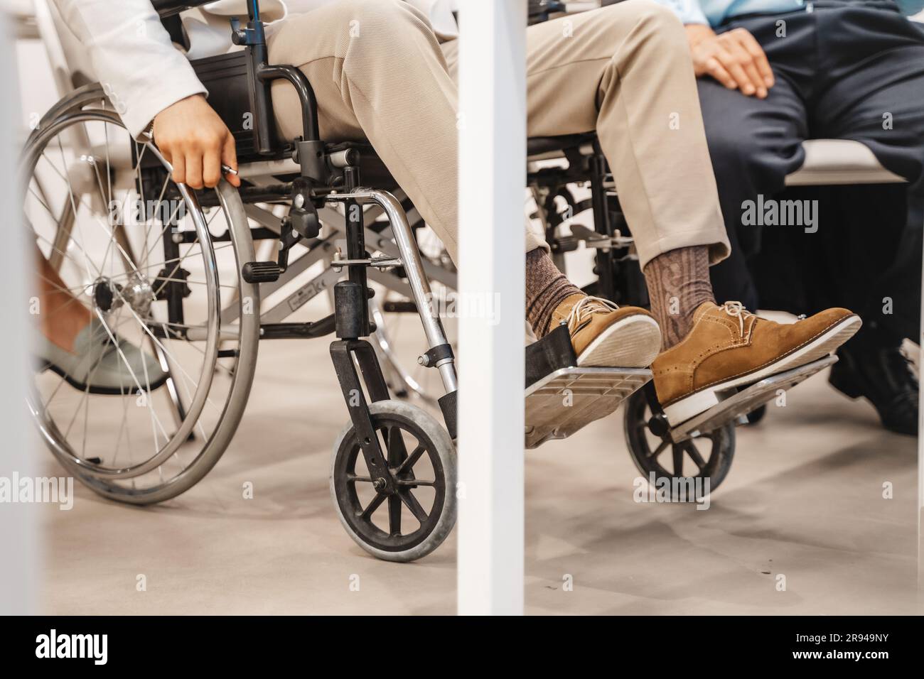 Male employee in wheelchair hi-res stock photography and images - Alamy