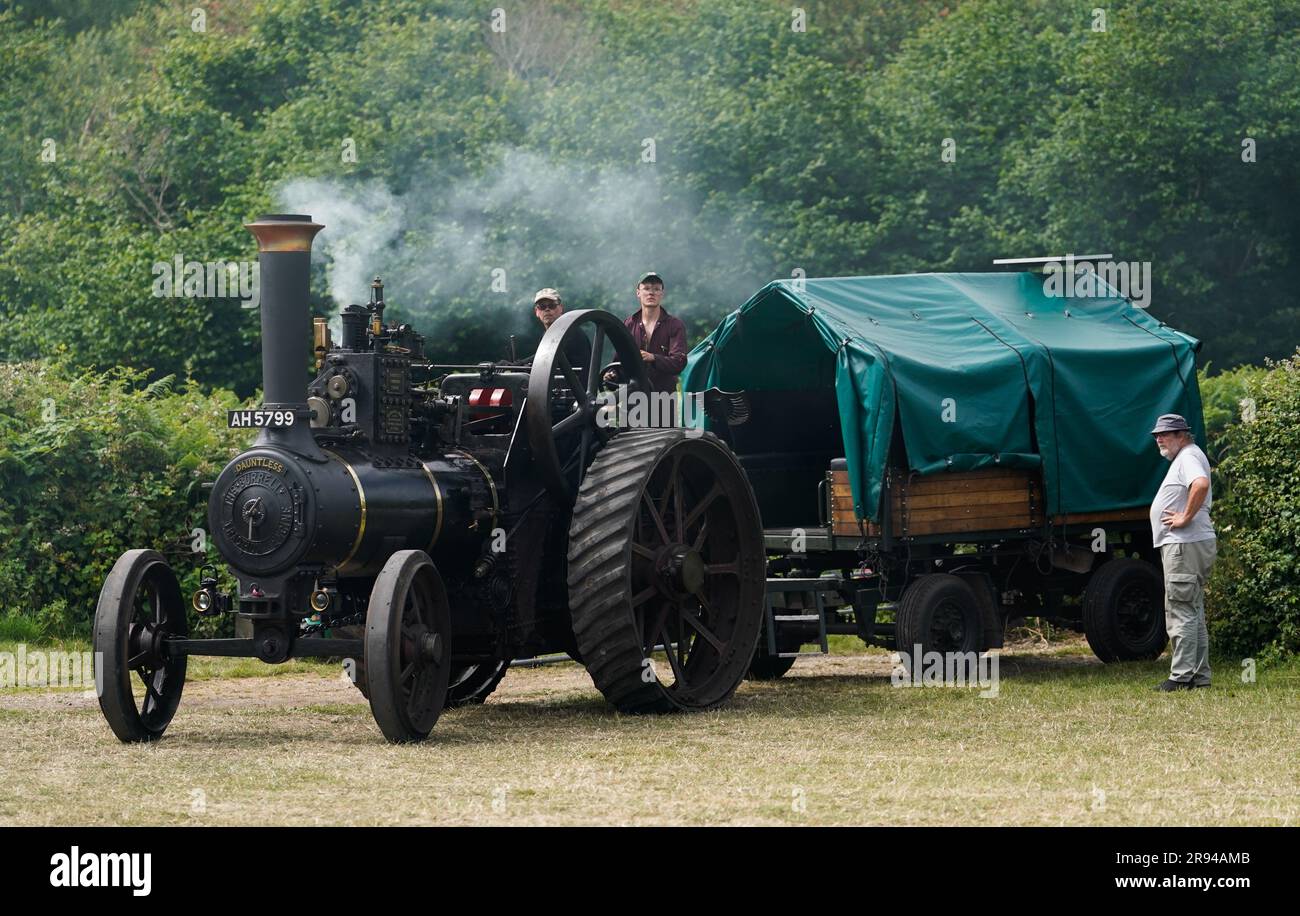 The Burrell General Purpose Engine 'Dauntless' is driven onto site during the Roads to Rail steam rally next to Norden station near the village of Corfe Castle, Dorset. The event features up to 50 traction and miniature engines, steam rollers and showman's engines, as well as fairground rides, trade stalls, food stalls, bar and live music. Picture date: Saturday June 24, 2023. Stock Photo