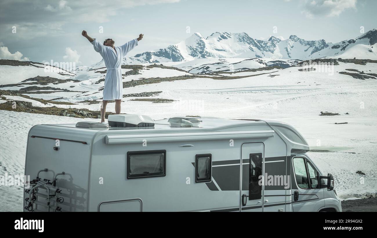 Midlife Caucasian Men Feeling Excitement and Freedom While on the Camper Van RV Road Trip Through the Norwegian Wilderness. Stock Photo