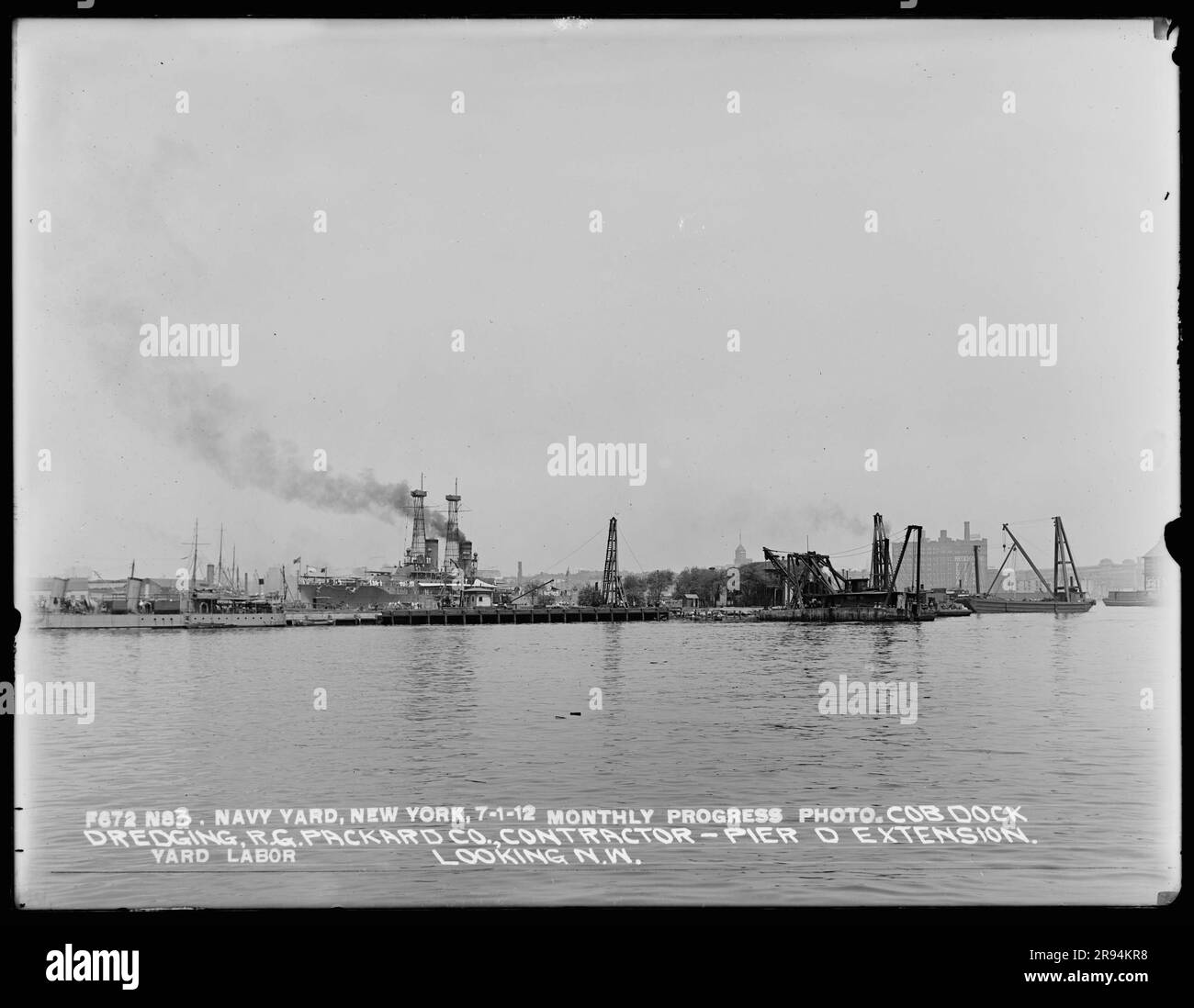 Monthly Progress Photo, Cob Dock Dredging, Pier D Extension Looking Northwest, Yard Labor, R. G. Packard Company, Contractor. Glass Plate Negatives of the Construction and Repair of Buildings, Facilities, and Vessels at the New York Navy Yard. Stock Photo