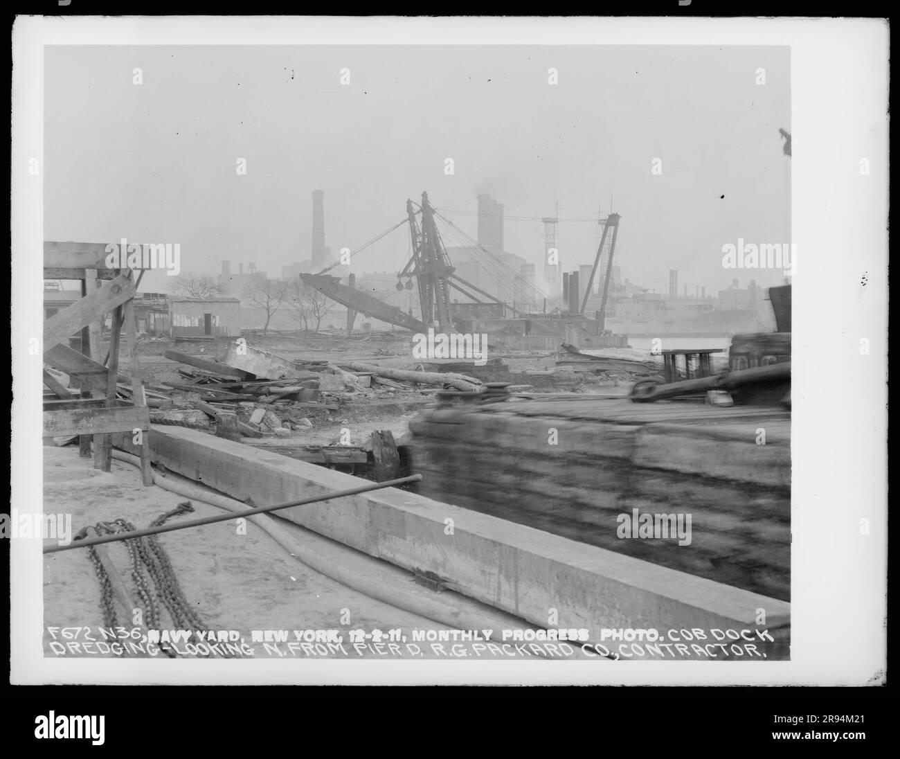 Monthly Progress Photo, Cob Dock Dredging, Looking North from Pier, R. G. Packard Company, Contractor. Glass Plate Negatives of the Construction and Repair of Buildings, Facilities, and Vessels at the New York Navy Yard. Stock Photo