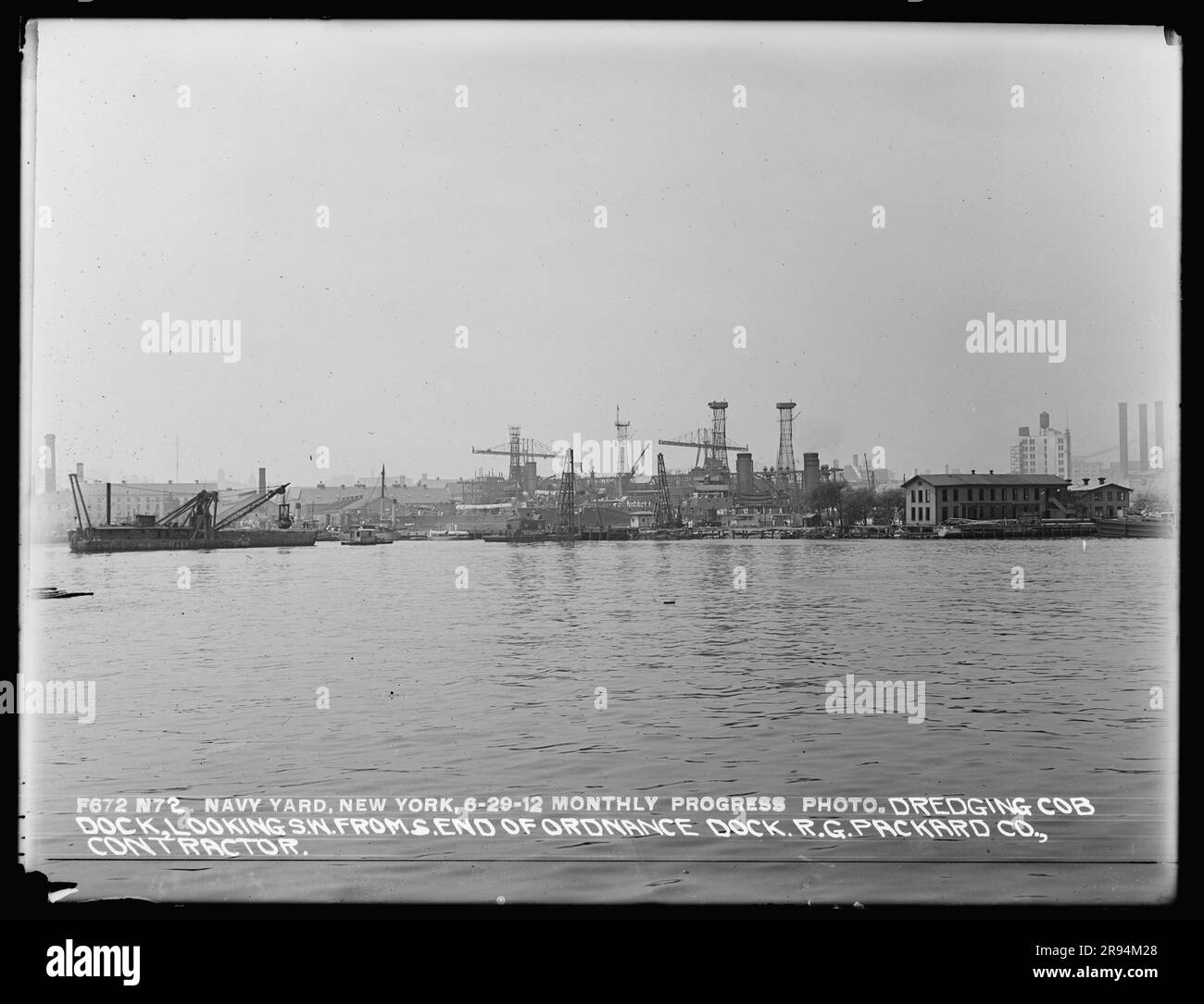 Monthly Progress Photo, Dredging Cob Dock, Looking Southwest from South End of Ordnance Dock, R. G. Packard Company, Contractor. Glass Plate Negatives of the Construction and Repair of Buildings, Facilities, and Vessels at the New York Navy Yard. Stock Photo