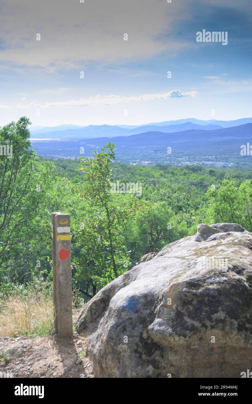 Short distance road sign with yellow white spots in Valle del Ambroz ...