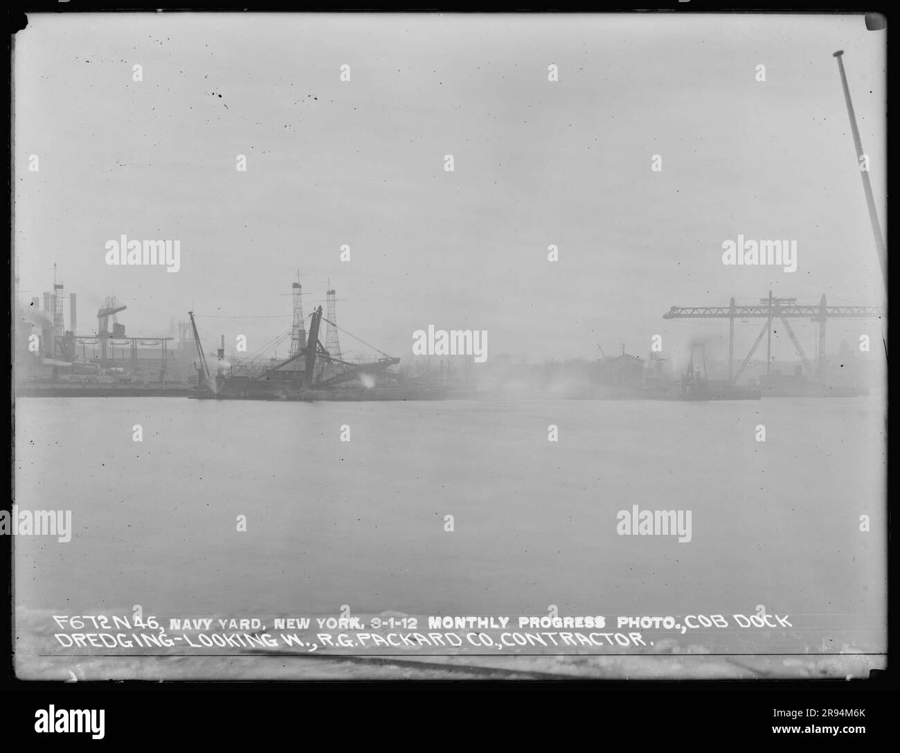 Monthly Progress Photo, Cob Dock Dredging, Looking West, R. G. Packard Company, Contractor. Glass Plate Negatives of the Construction and Repair of Buildings, Facilities, and Vessels at the New York Navy Yard. Stock Photo