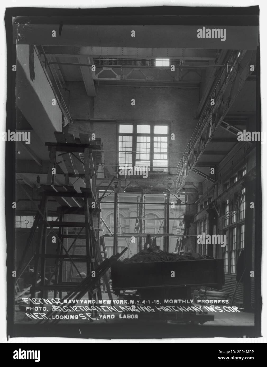 Monthly Progress Photo, Building Number 127 (44), Enlarging Hatchway in South Corner, Looking Southeast. Glass Plate Negatives of the Construction and Repair of Buildings, Facilities, and Vessels at the New York Navy Yard. Stock Photo