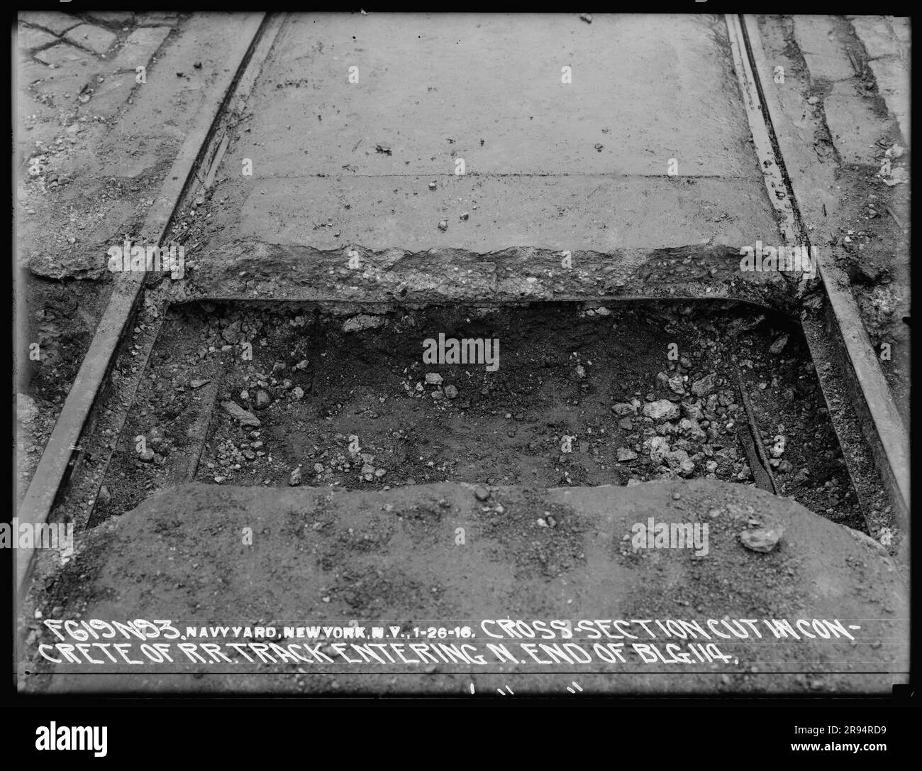 Cross-Section Cut in Concrete of Railroad Track Entering North End of Building 114. Glass Plate Negatives of the Construction and Repair of Buildings, Facilities, and Vessels at the New York Navy Yard. Stock Photo